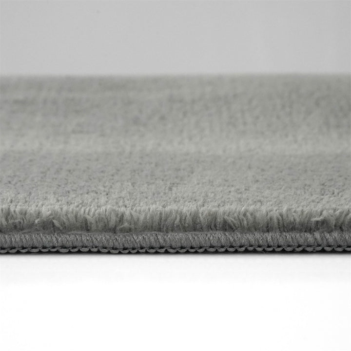 Washmellow grey washable rug, side view of the low pile and edge at floor level | The Rugs