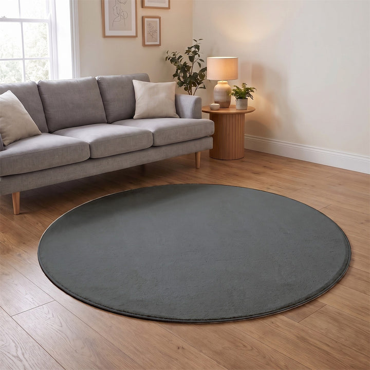 Washmellow grey round washable rug in a living room | The Rugs