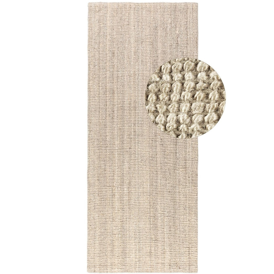 Textured beige rug with a circular textured mat on a white background