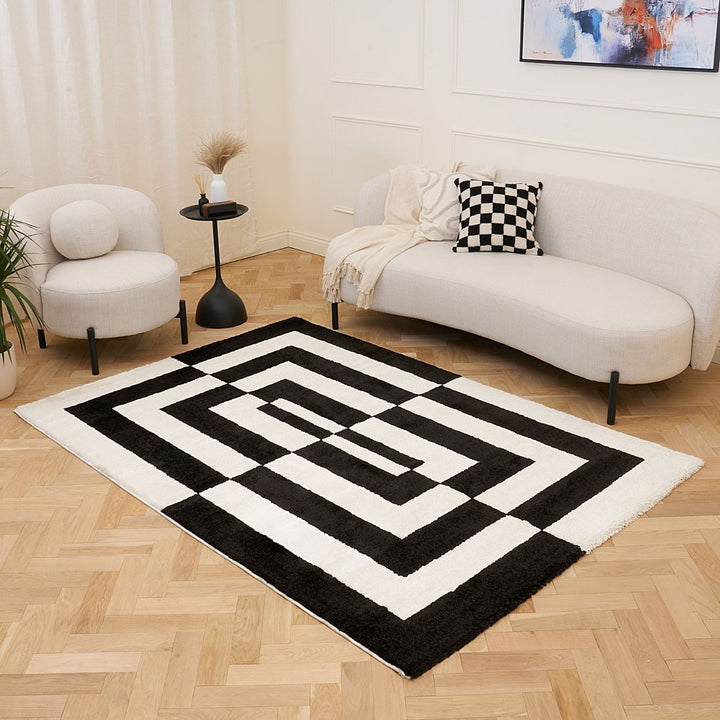 Black and white geometric patterned rug