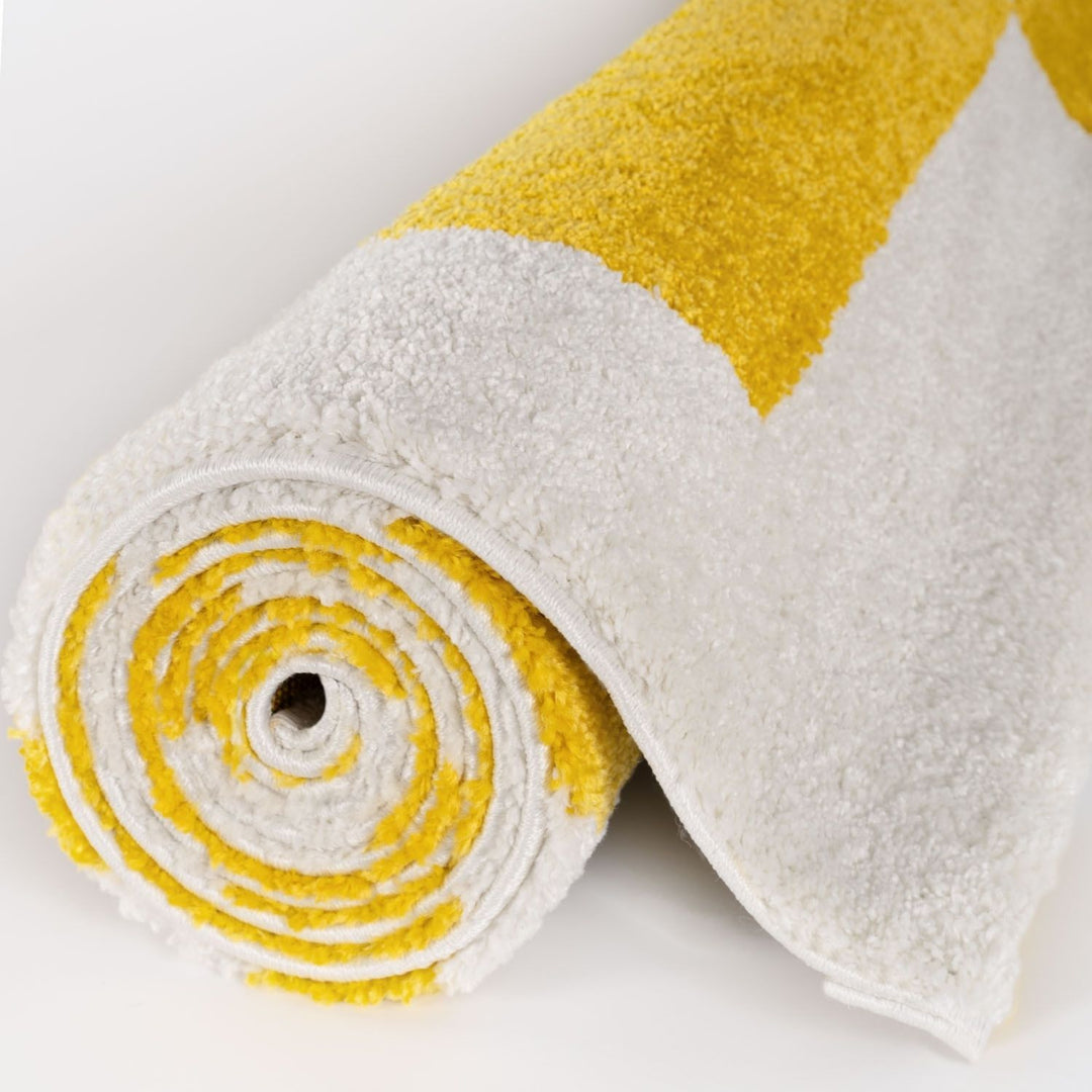 Roll of white and yellow fabric on a light gray background
