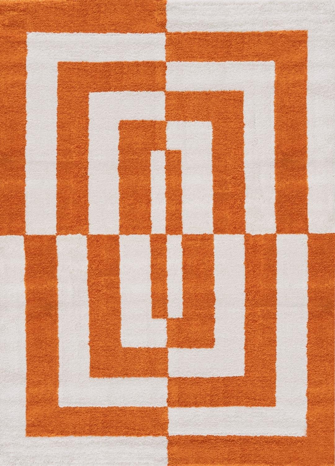 Rug with orange and white geometric pattern