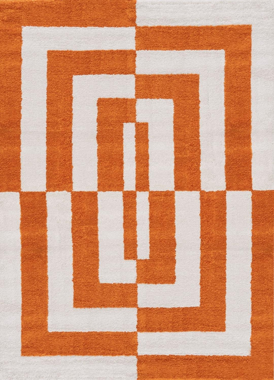 Rug with orange and white geometric pattern