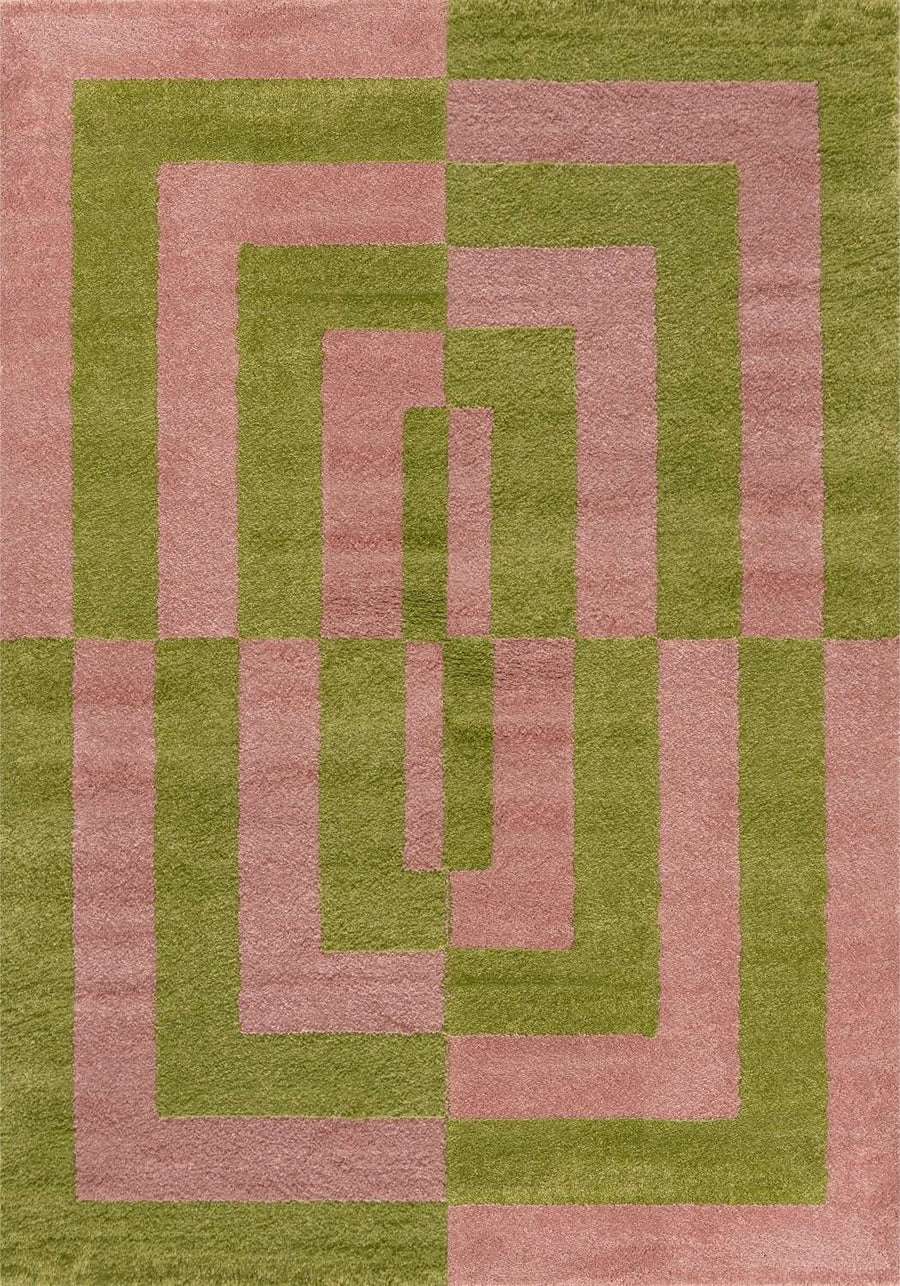 Geometric patterned rug with pink and green colors