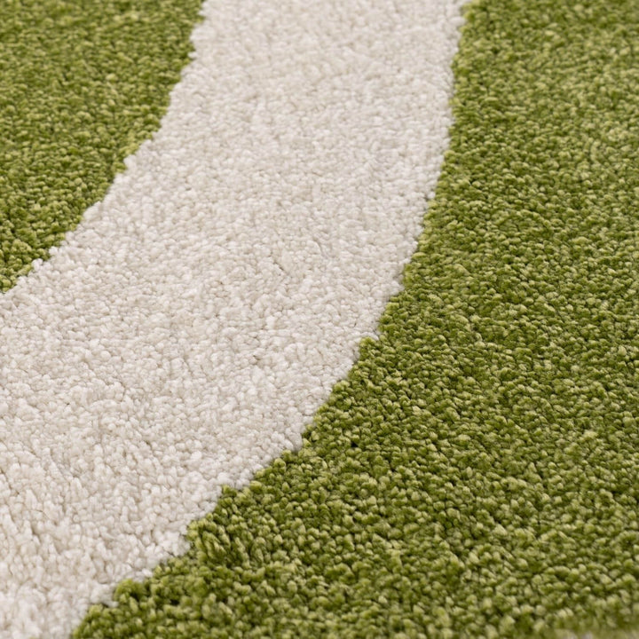 Close-up of green and beige carpet texture