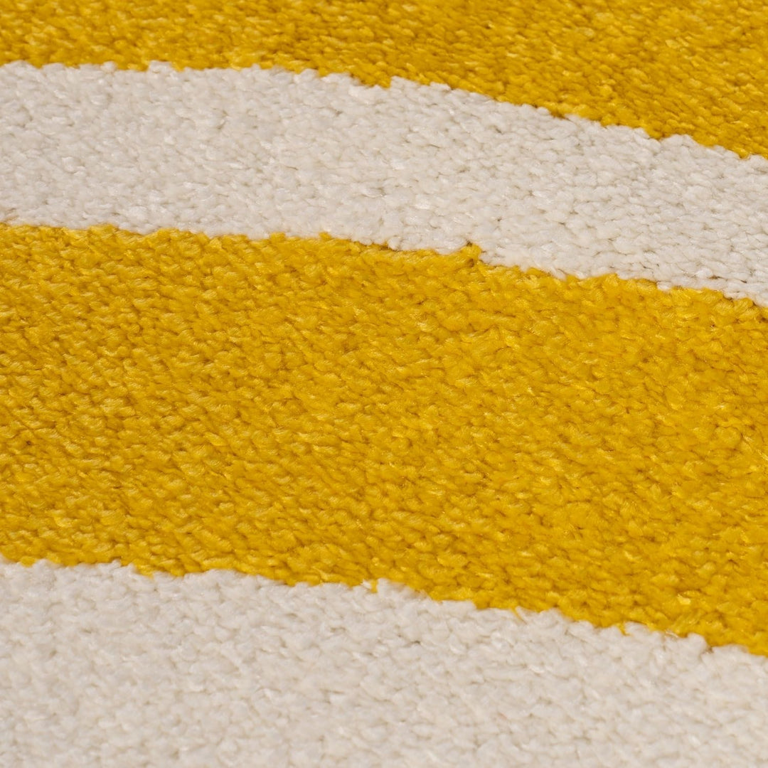 Close-up of a textured surface with yellow and white stripes