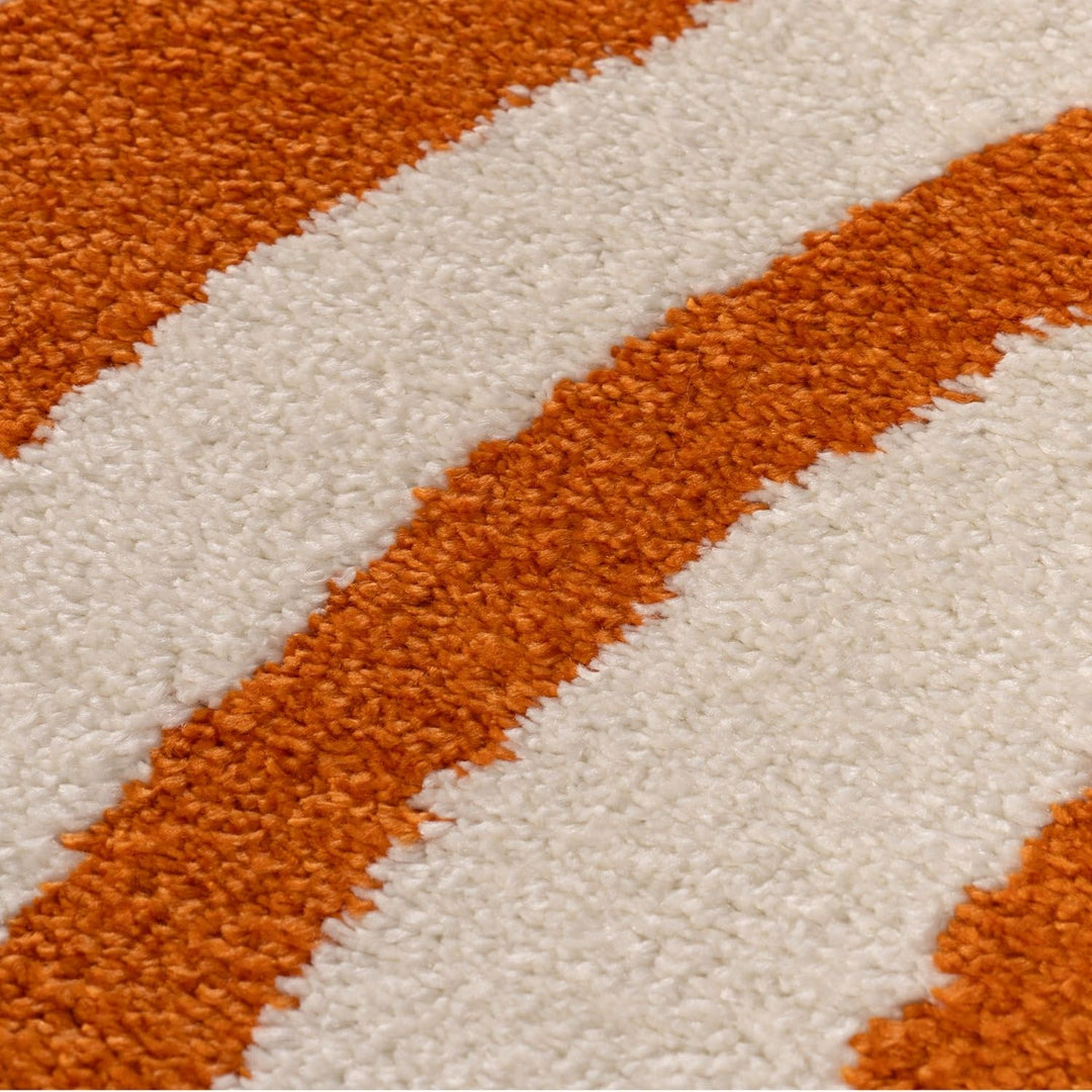 Close-up of a textured orange and white striped fabric