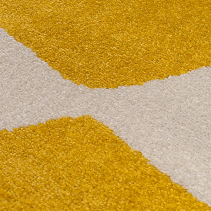 Close-up of a textured yellow and beige rug
