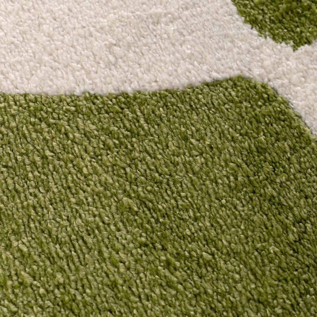 Close-up of green and beige carpet texture