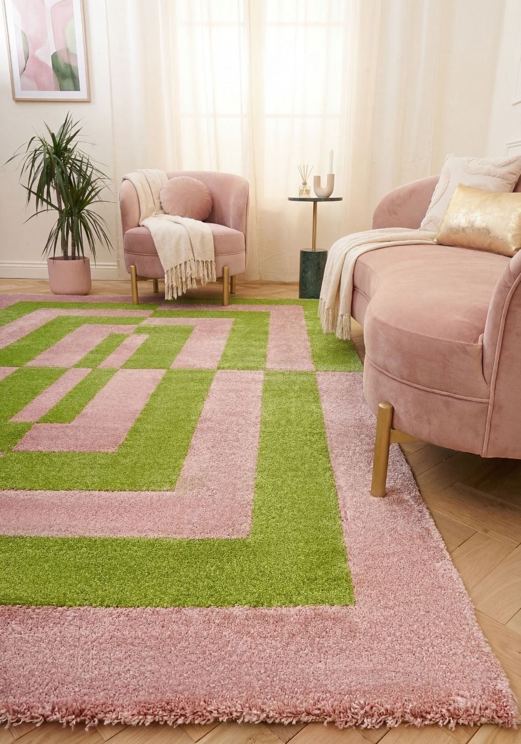 Geometric patterned rug with pink and green colors living room