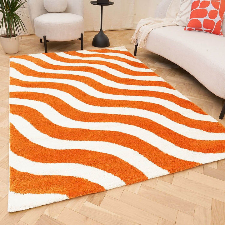 Rug with orange and white wavy pattern