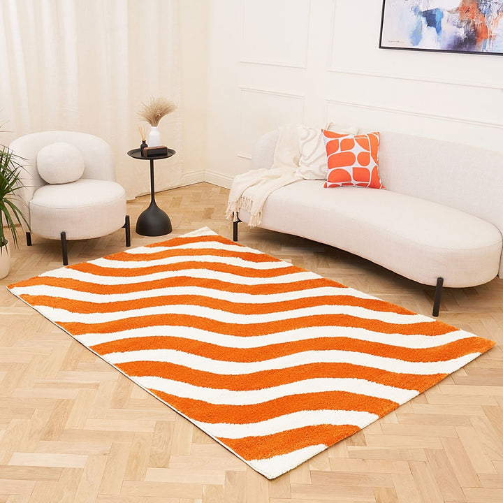 Rug with orange and white wavy pattern