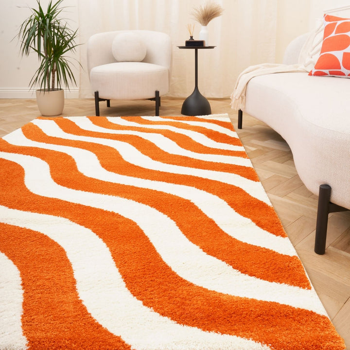Rug with orange and white wavy pattern