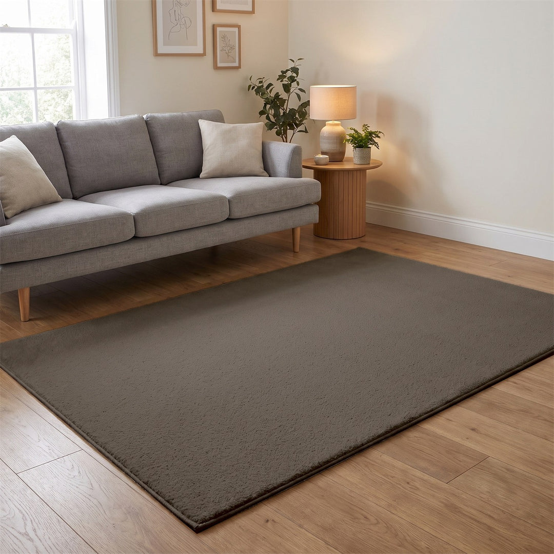 Washmellow light brown washable rug in a living room with a grey sofa and oak floor | The Rugs