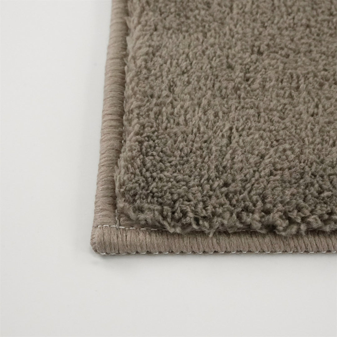 Washmellow light brown washable rug, close-up of the corner and bound edge | The Rugs