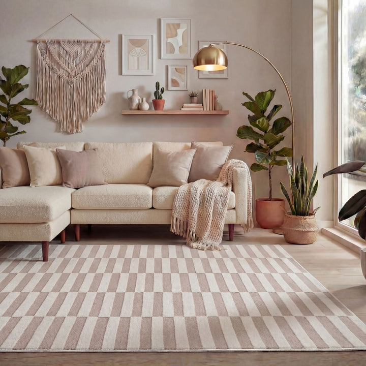 Cozy living room with a beige sectional sofa, striped rug, and decorative elements.