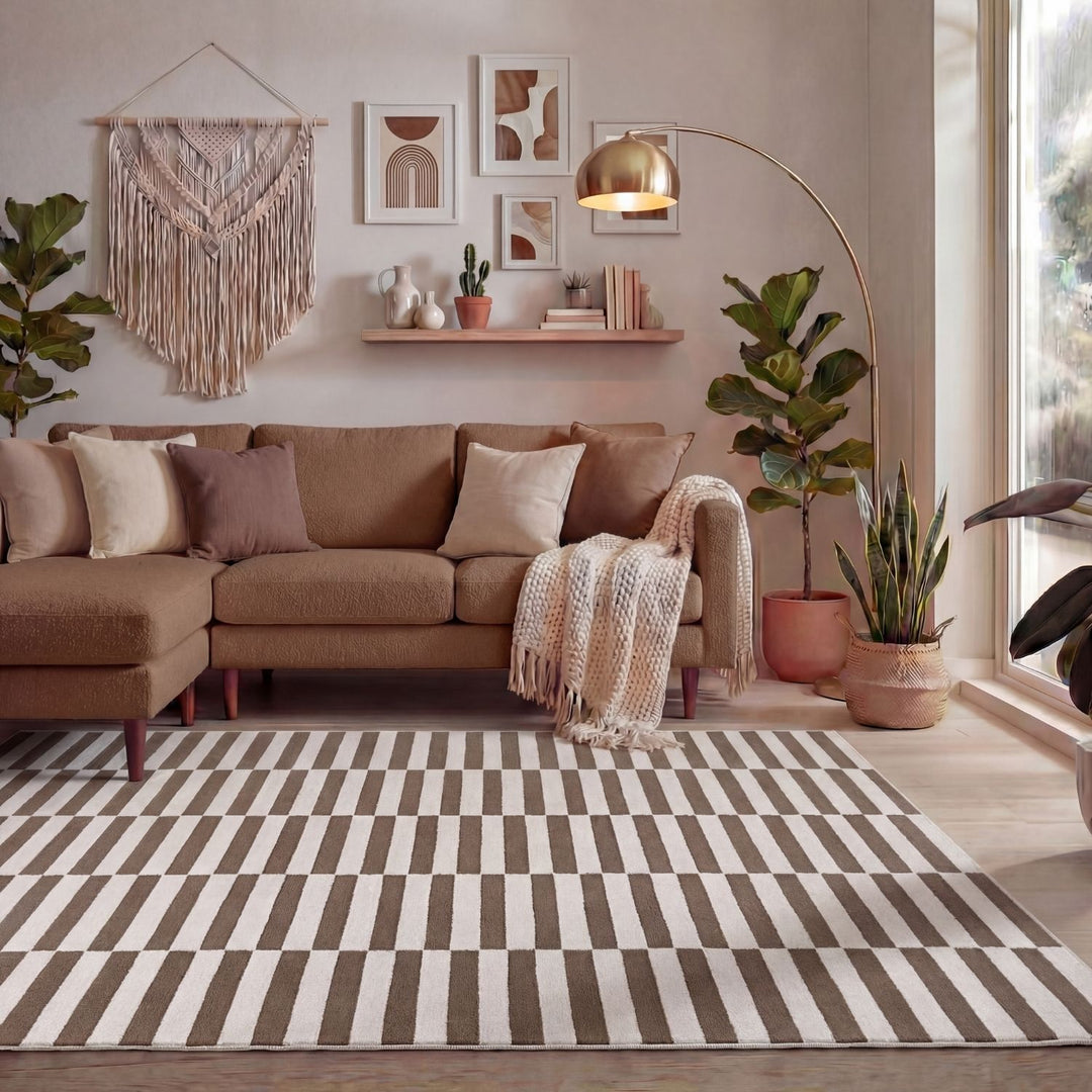 Cozy living room with a brown sectional sofa, striped rug, and decorative elements.