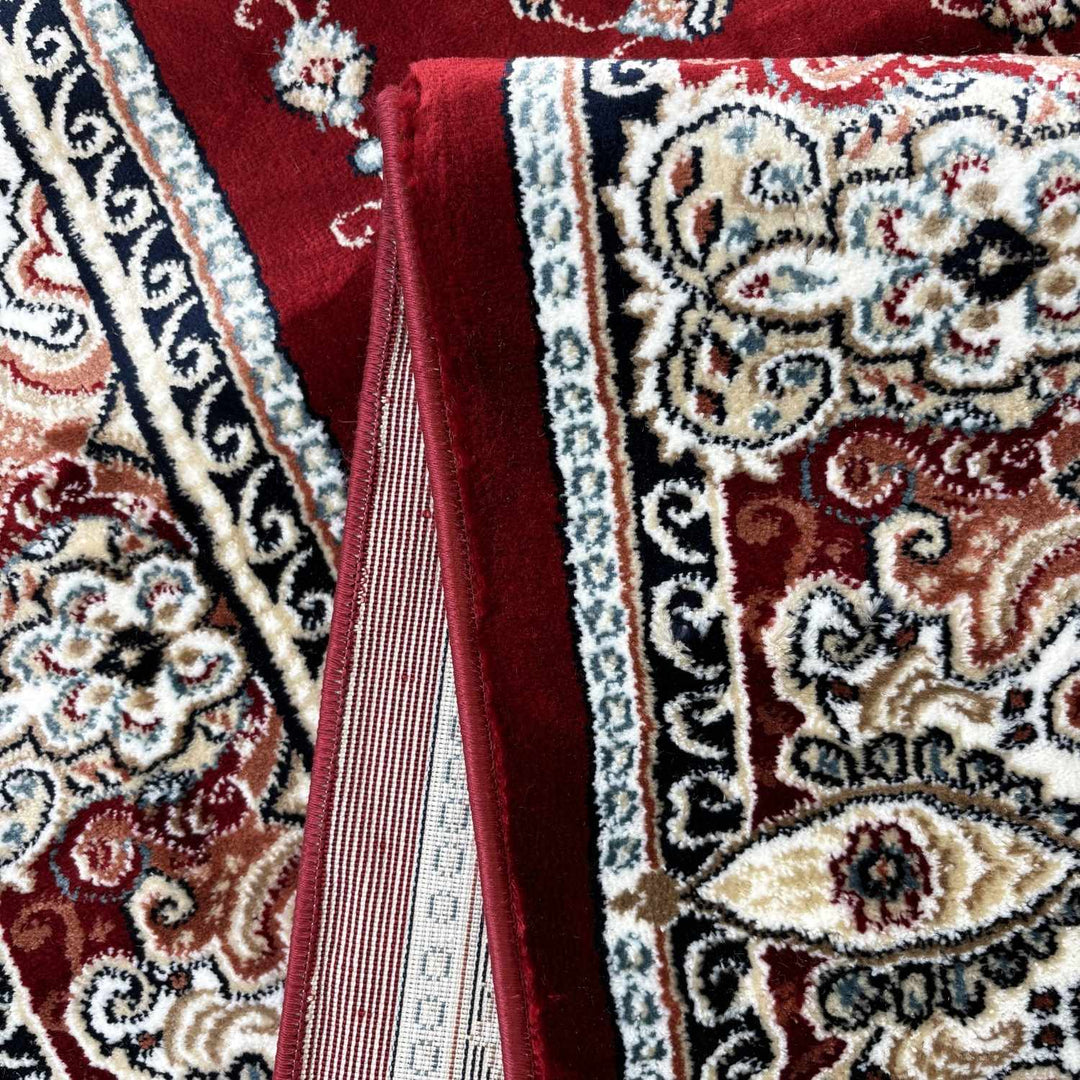 Close-up of a patterned rug with intricate designs and vibrant colors.