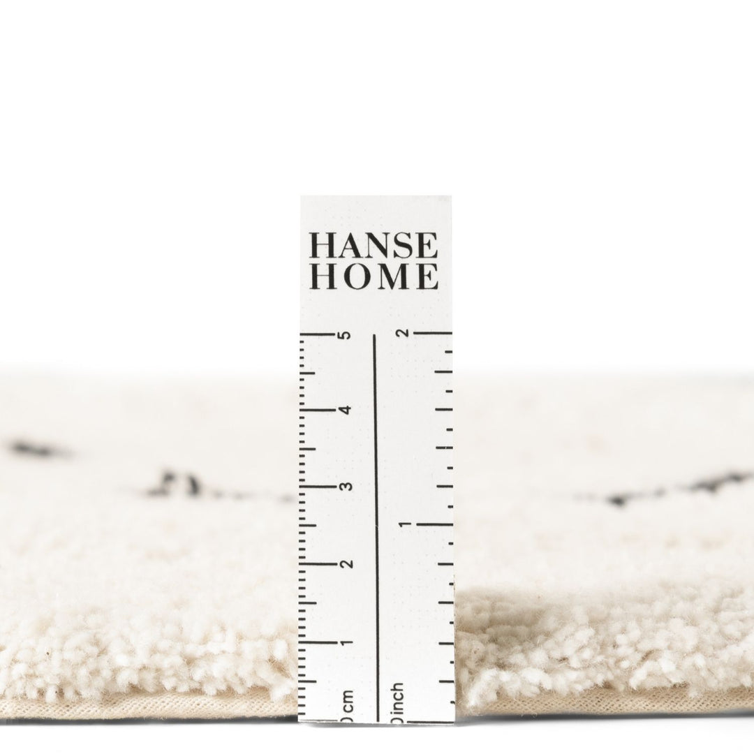 Hanse Home rug with a ruler for scale on a white background