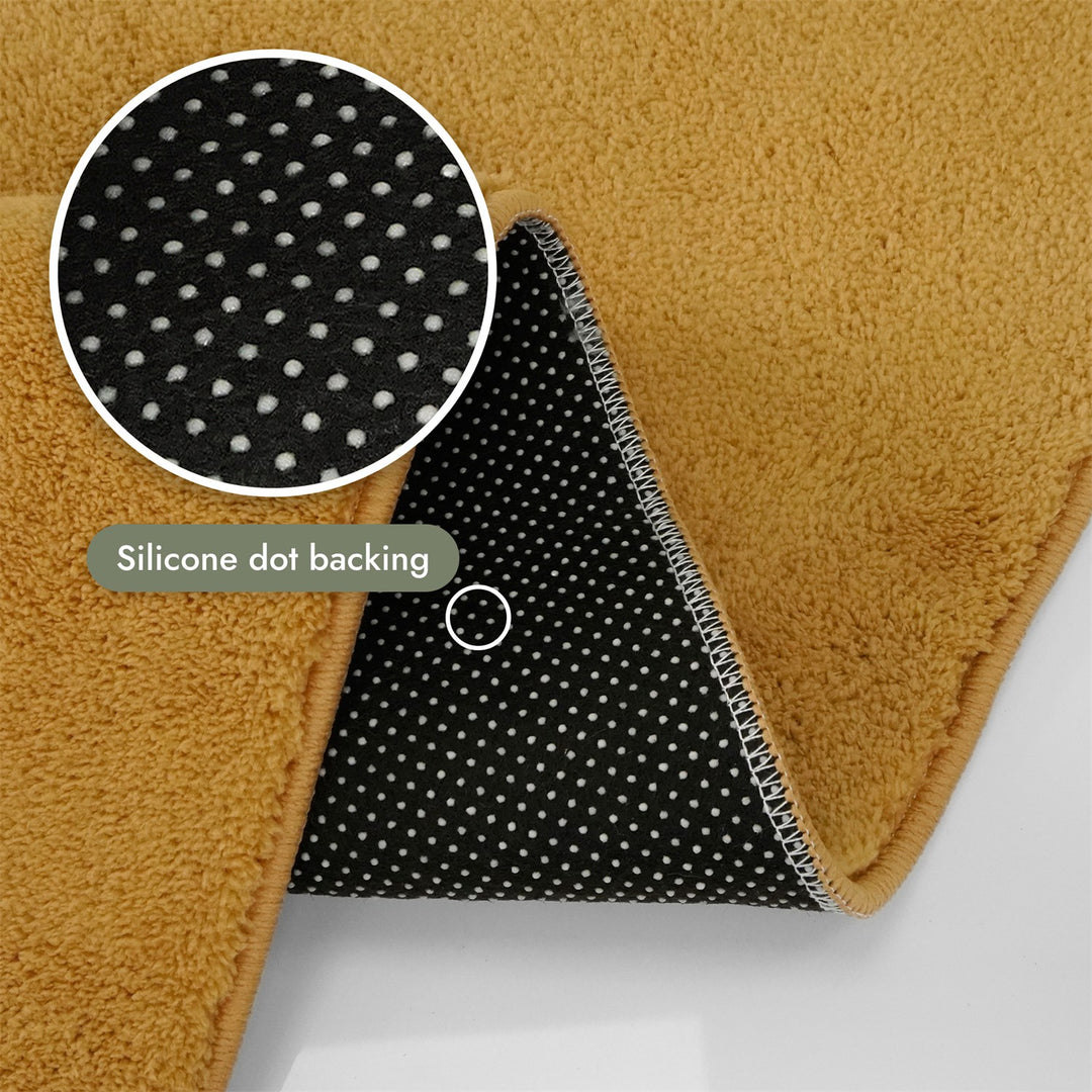 Washmellow ochre washable rug, silicone dot backing that grips hard floors | The Rugs