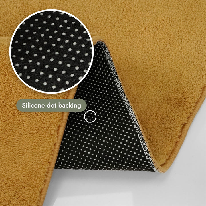 Washmellow ochre washable rug, silicone dot backing that grips hard floors | The Rugs