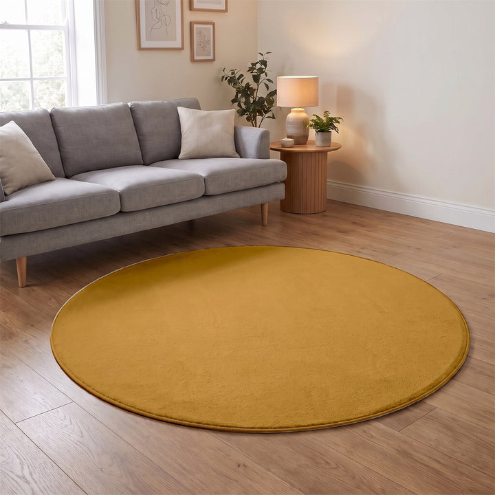 Washmellow ochre round washable rug in a living room | The Rugs