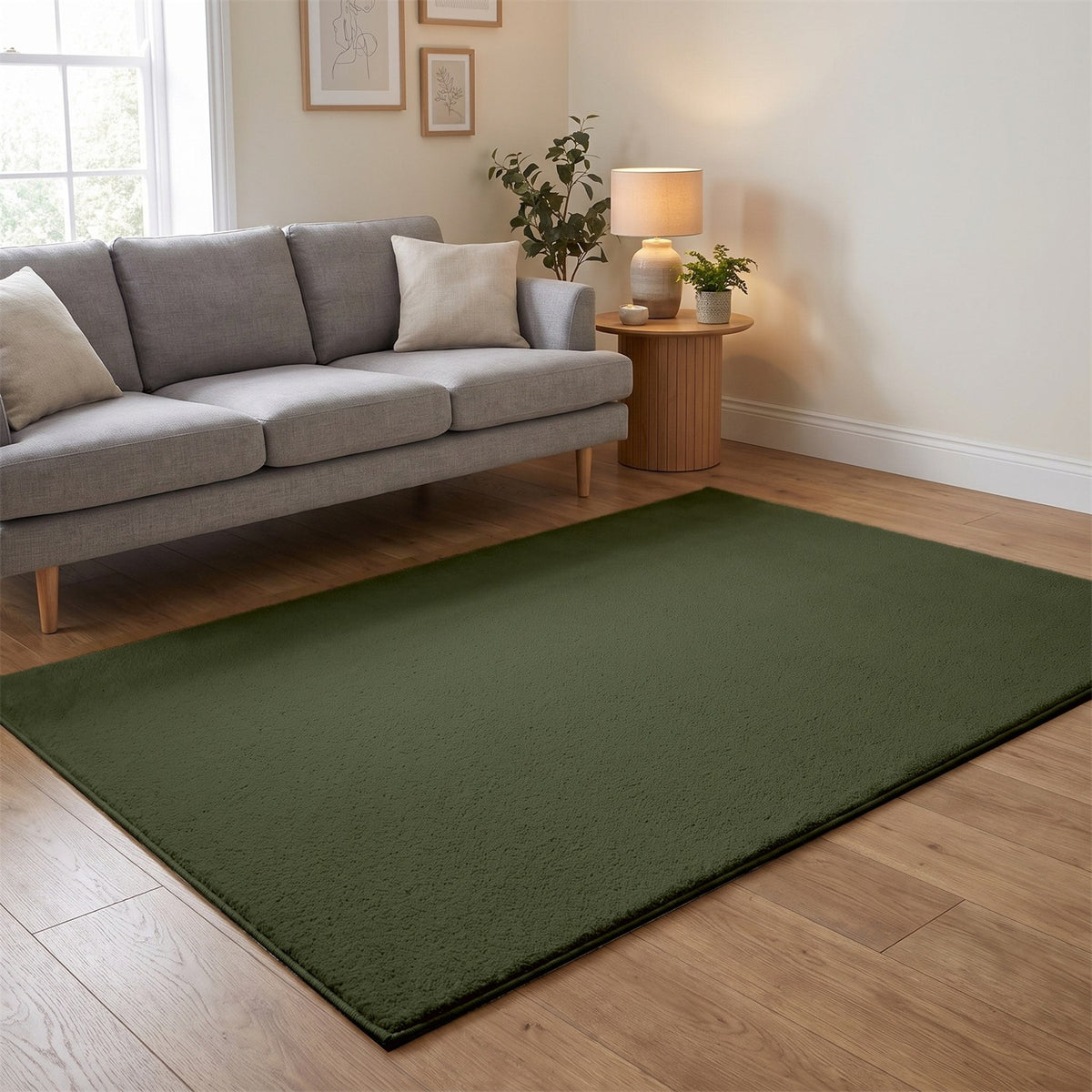 Washmellow olive green washable rug in a living room with a grey sofa and oak floor | The Rugs