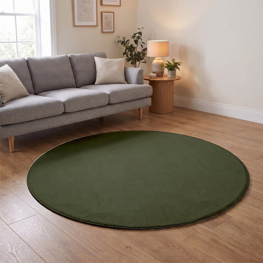 Washmellow olive green round washable rug in a living room | The Rugs