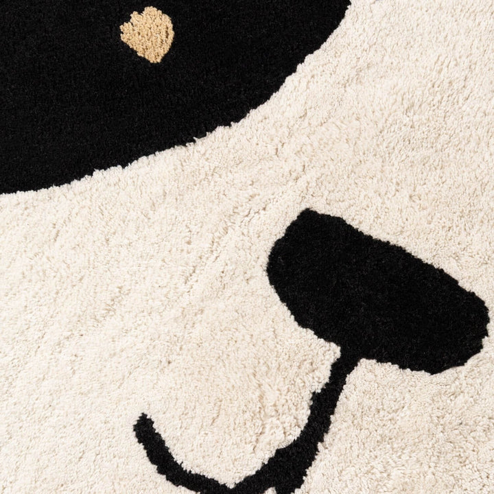 Close-up of a rug with a cartoon character design on a white background