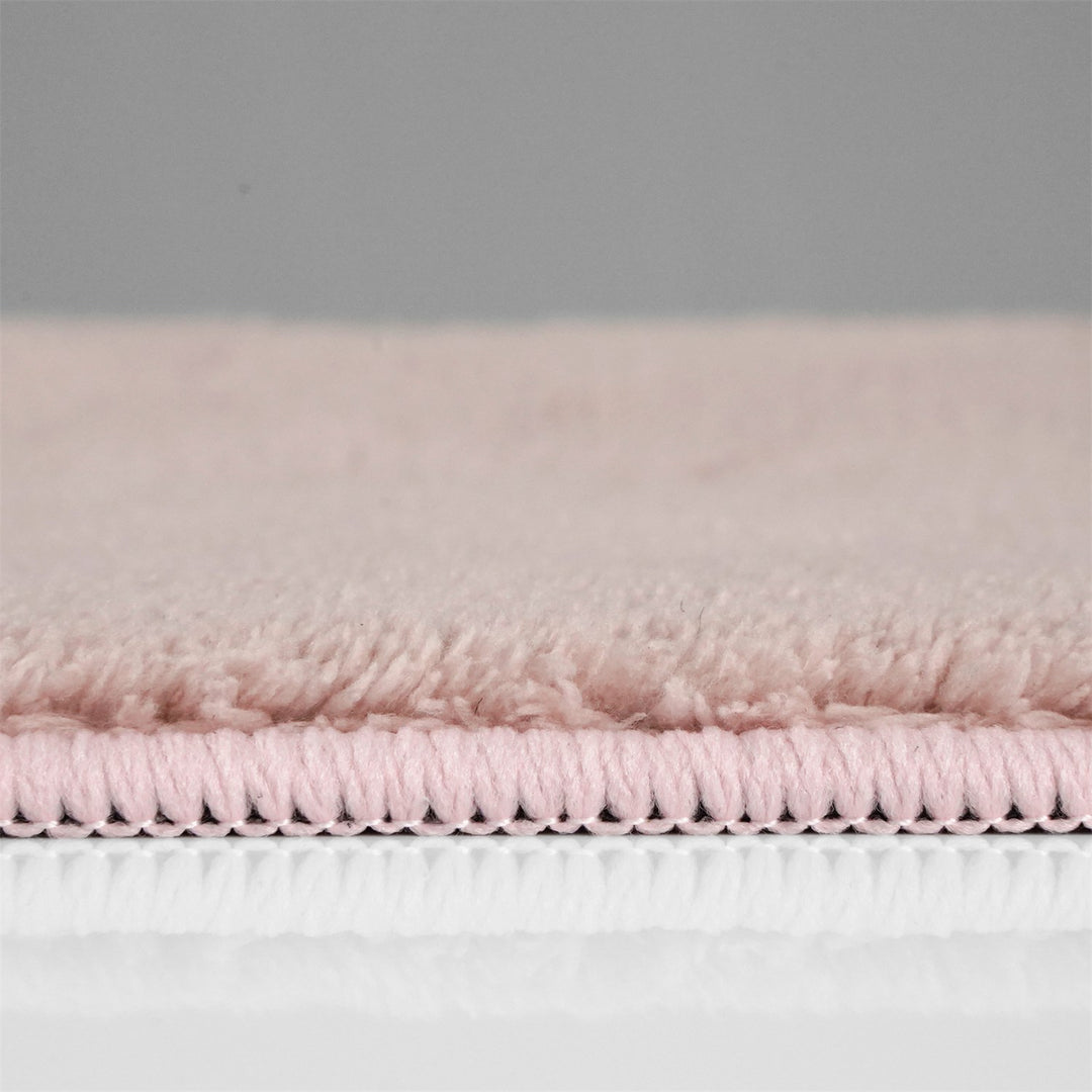 Washmellow pink washable rug, side view of the low pile and edge at floor level | The Rugs