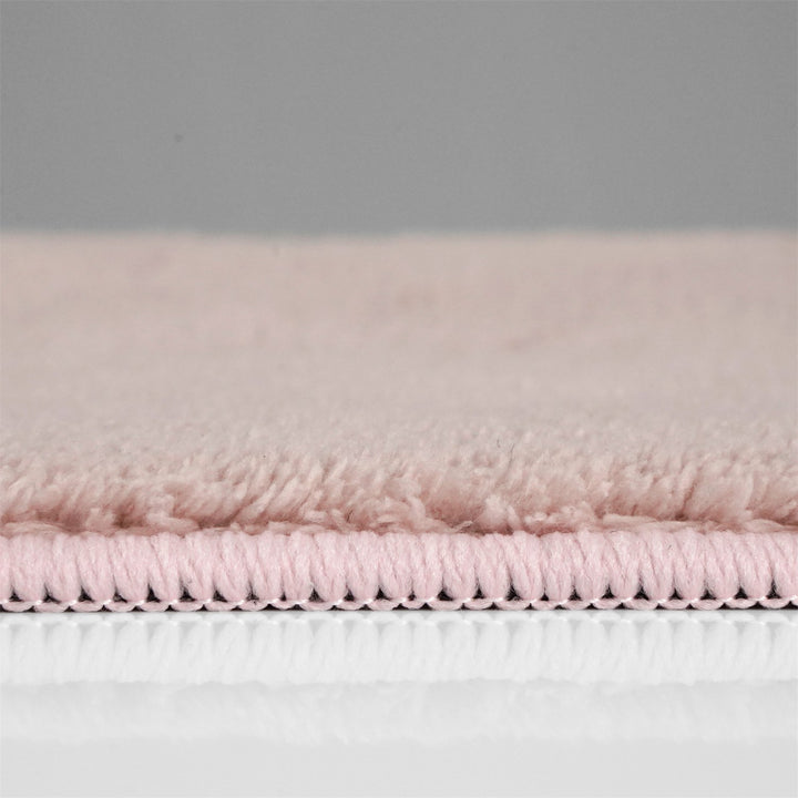 Washmellow pink washable rug, side view of the low pile and edge at floor level | The Rugs