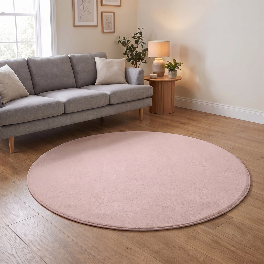 Washmellow pink round washable rug in a living room | The Rugs