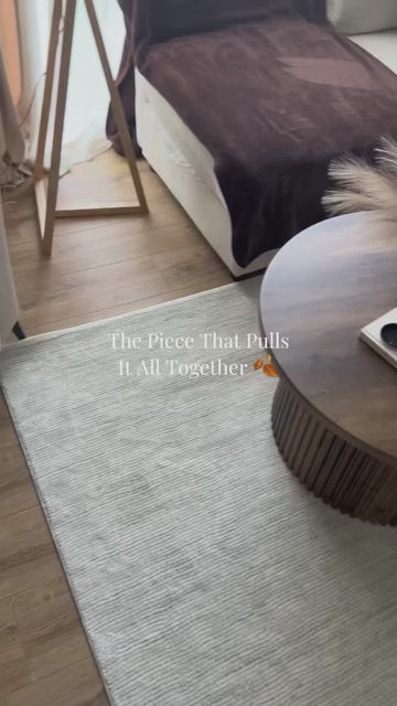Our living room finally feels finished 🍂 It just needed one last piece, and the Carmel rug in Cream-Grey Striped from @the.rugs pulled it all together. It fits in perfectly with th