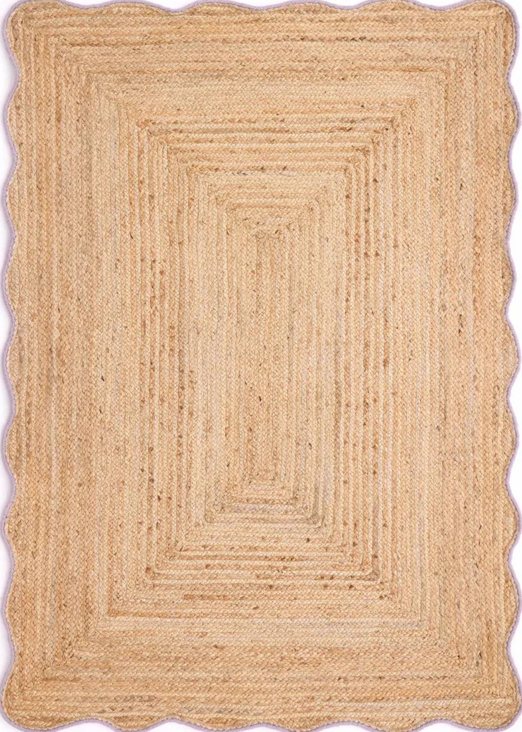 Beige braided rug with a rectangular pattern on a plain background