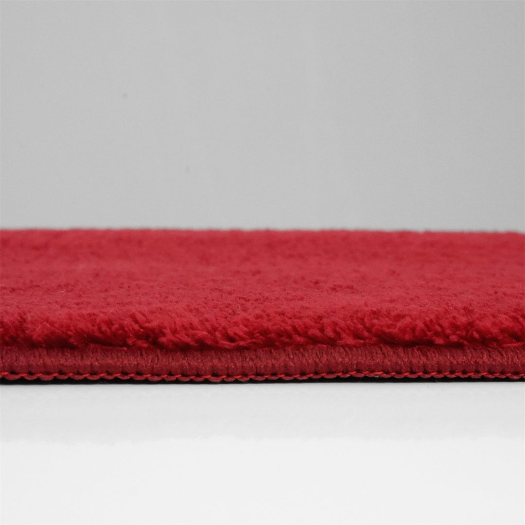 Washmellow red washable rug, side view of the low pile and edge at floor level | The Rugs