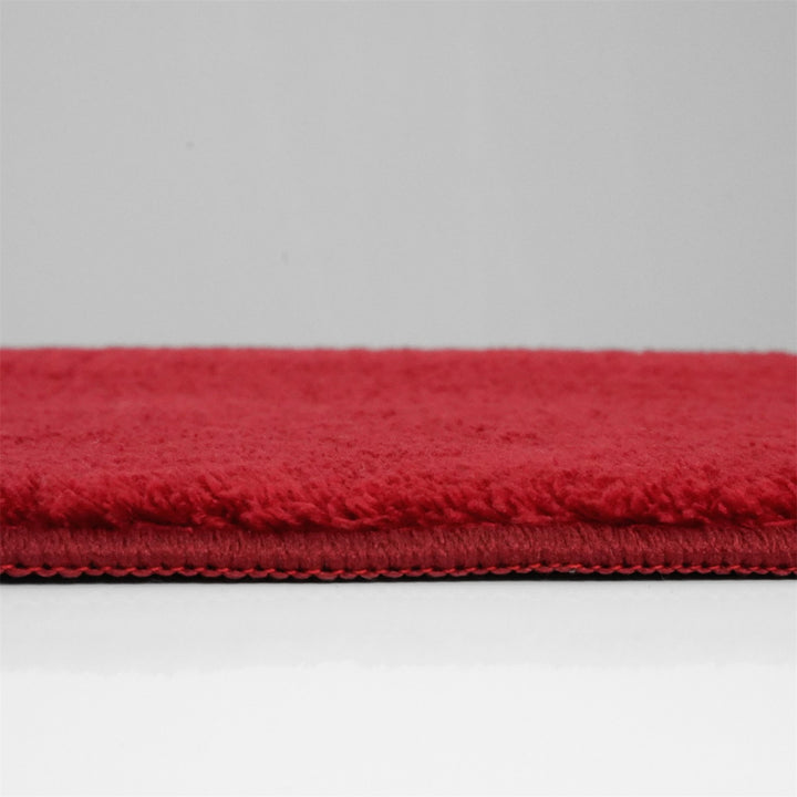 Washmellow red washable rug, side view of the low pile and edge at floor level | The Rugs