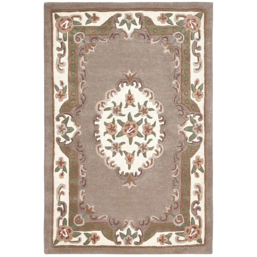 Decorative rug with floral pattern and border on a plain background