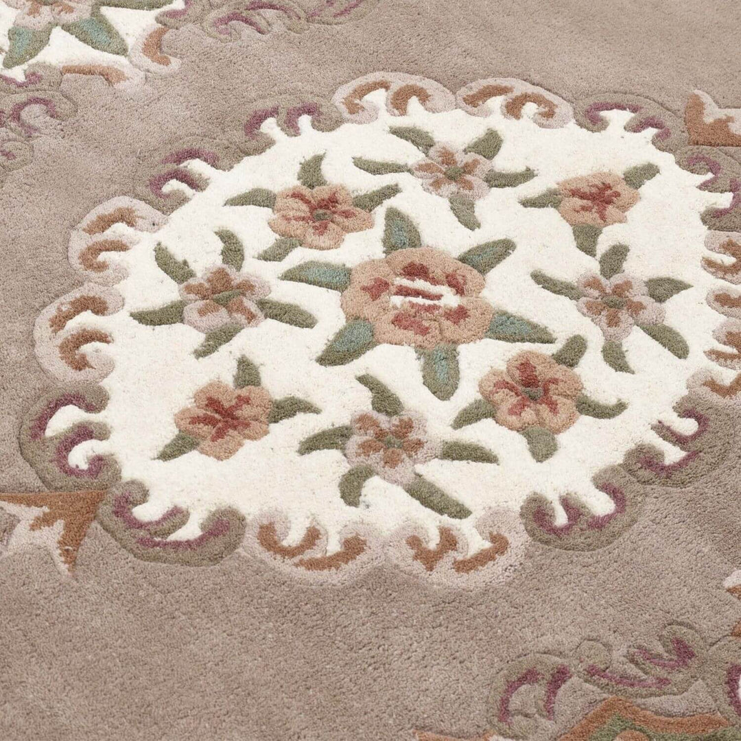 Decorative floral rug with a beige background