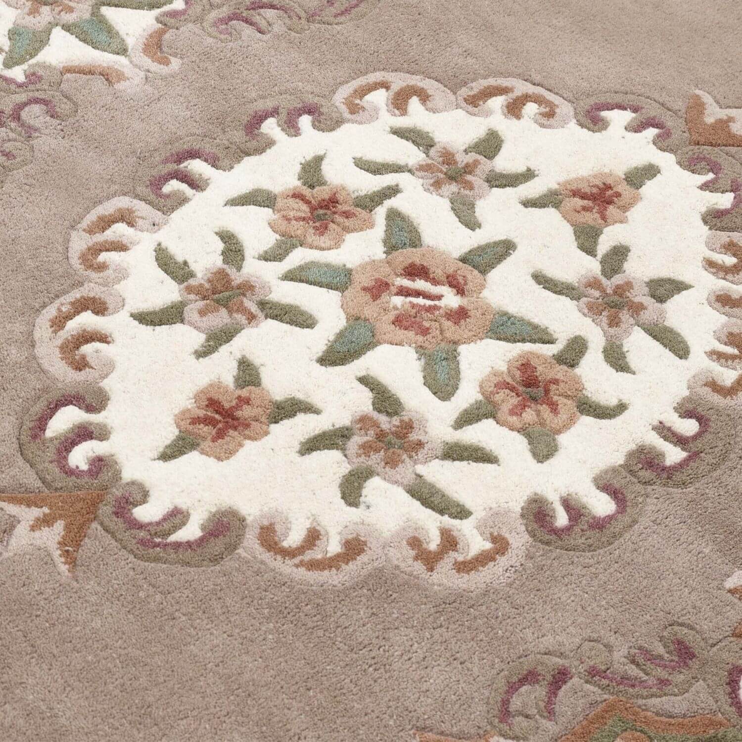 Decorative floral rug with a beige background