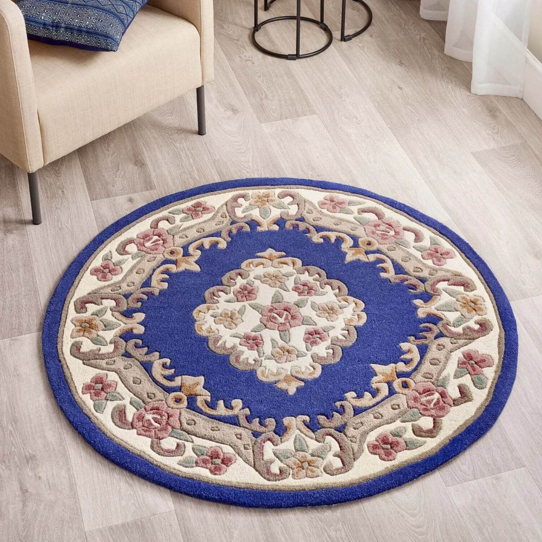 Round decorative rug with floral patterns on a wooden floor