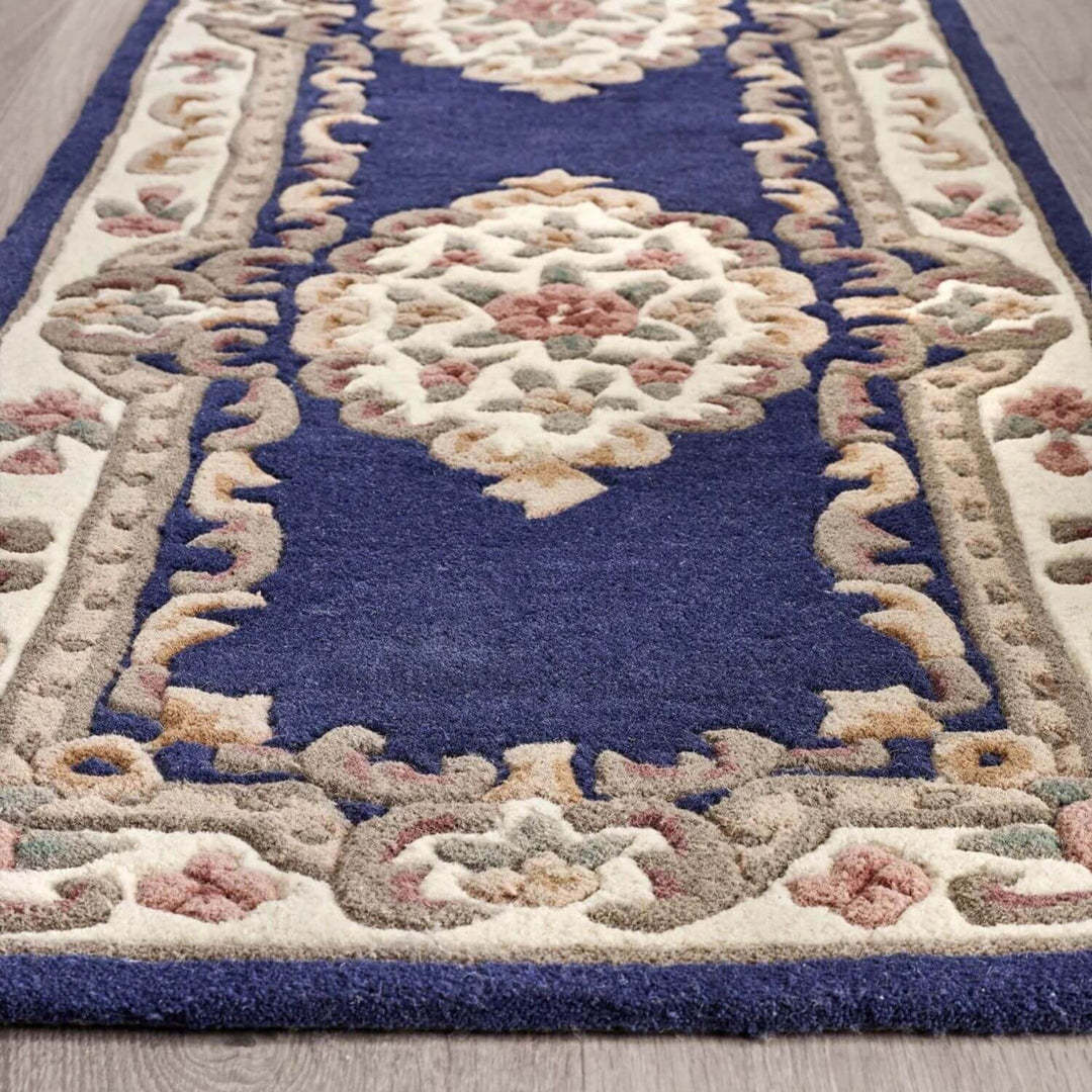 Decorative rug with intricate patterns on a wooden floor
