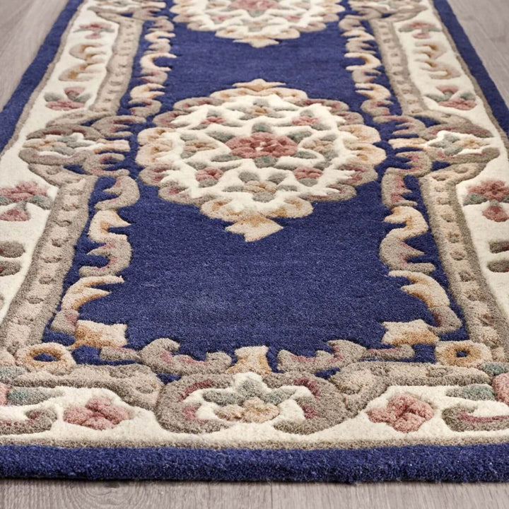 Decorative rug with intricate patterns on a wooden floor