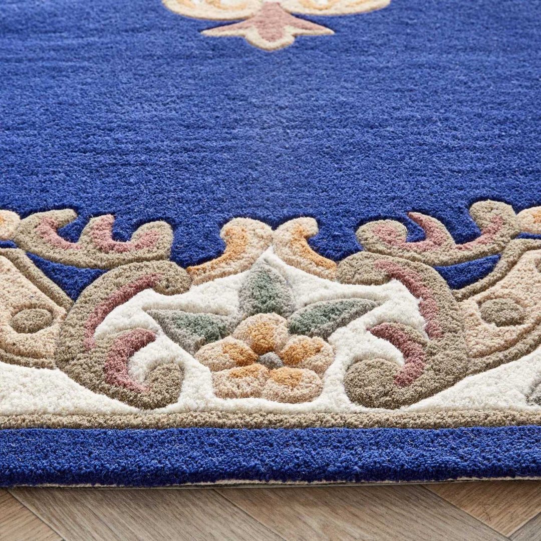 Decorative rug with intricate patterns on a wooden floor
