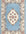Decorative rug with floral pattern and intricate border on a light blue background