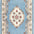 Decorative rug with floral pattern and intricate border on a light blue background
