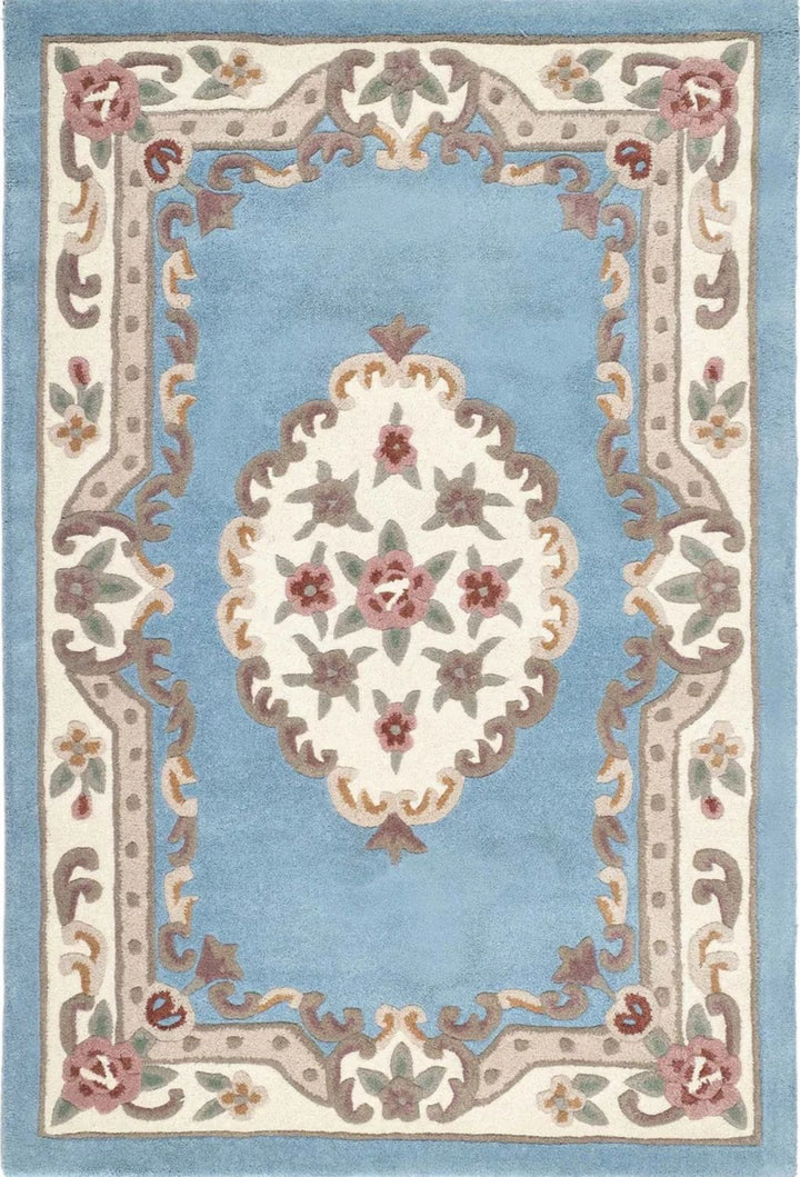 Decorative rug with floral pattern and intricate border on a light blue background