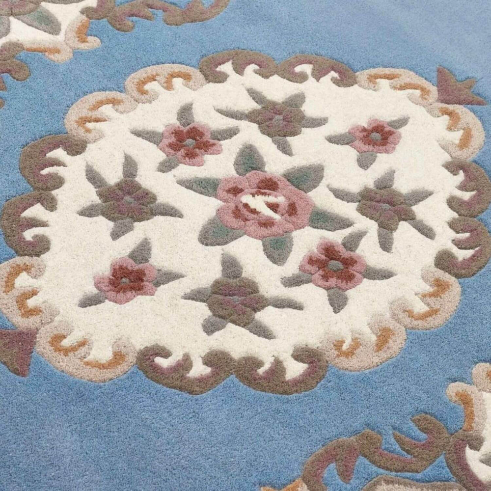 Decorative rug with floral pattern on a blue background