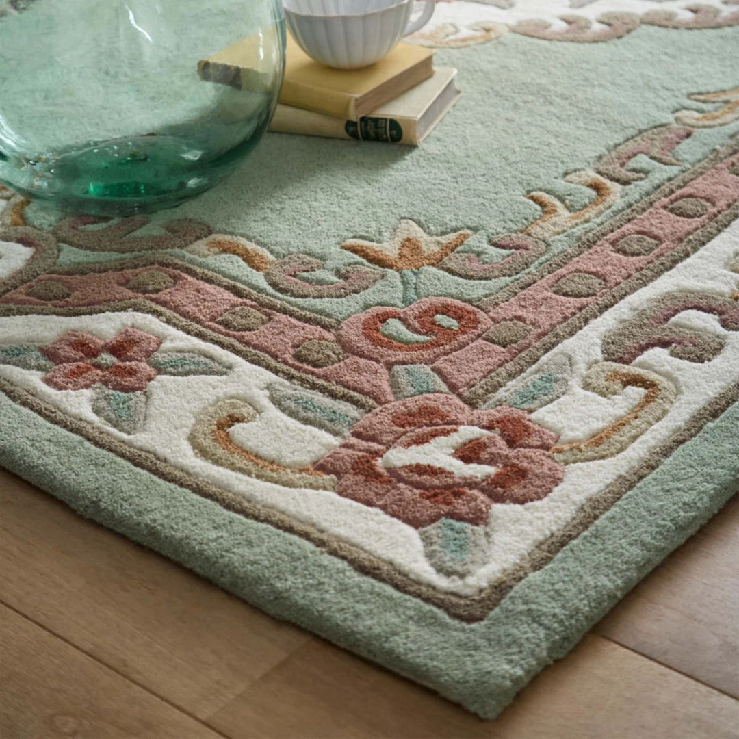 Decorative rug with floral patterns on a wooden floor
