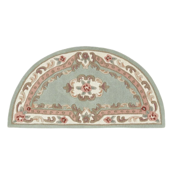 Decorative half-circle rug with floral patterns on a white background