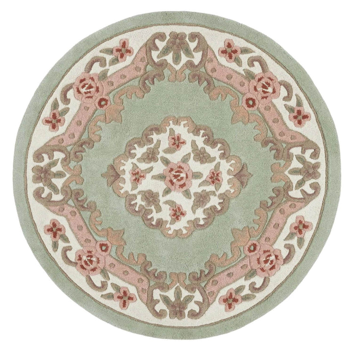 Round decorative rug with floral patterns on a light green background